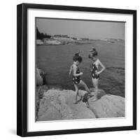 Two Little Girls Modelling Sun Dot Bathing Suits While Playing on the Rocks-Nina Leen-Framed Photographic Print