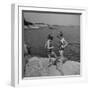 Two Little Girls Modelling Sun Dot Bathing Suits While Playing on the Rocks-Nina Leen-Framed Photographic Print