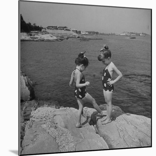 Two Little Girls Modelling Sun Dot Bathing Suits While Playing on the Rocks-Nina Leen-Mounted Photographic Print