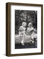 Two Little Girls Sitting on a Bench-Philip Gendreau-Framed Photographic Print