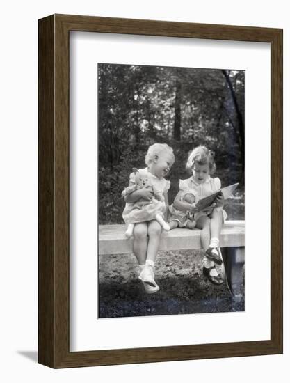 Two Little Girls Sitting on a Bench-Philip Gendreau-Framed Photographic Print