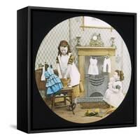 Two Little Girls Wash Their Dolls' Clothes-null-Framed Stretched Canvas