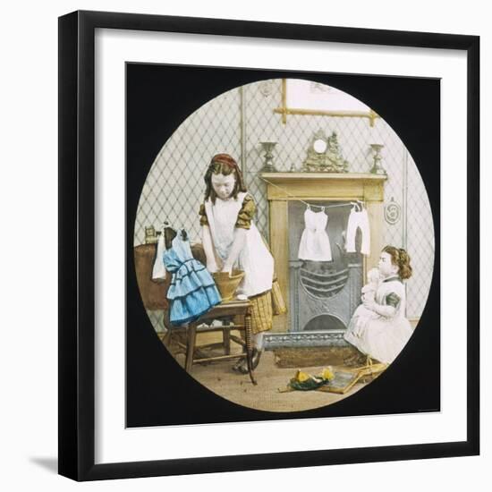 Two Little Girls Wash Their Dolls' Clothes-null-Framed Photographic Print