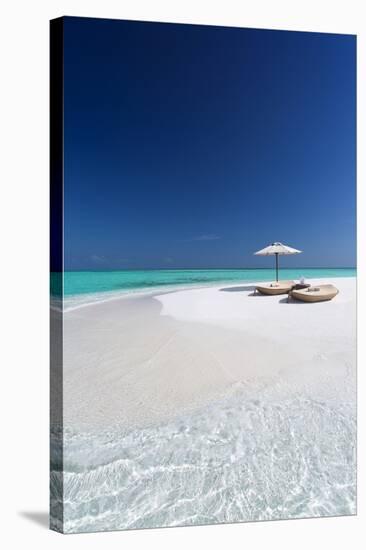 Two lounge chairs with sun umbrella on a tropical beach, The Maldives, Indian Ocean, Asia-Sakis Papadopoulos-Stretched Canvas