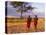 Two Maasai Morans Walking with Spears at Sunset, Amboseli National Park, Kenya-Alison Jones-Stretched Canvas