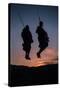 Two Masaai Warriors Silhouetted Performing Traditional Jump - Leap Kopje at Sunset-Nick Garbutt-Stretched Canvas