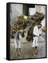 Two Men Carrying Bundles of Wood on their Backs, Mexico, Early 20th Century-null-Framed Stretched Canvas