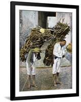Two Men Carrying Bundles of Wood on their Backs, Mexico, Early 20th Century-null-Framed Giclee Print