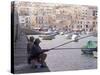 Two Men Fishing, Marsaskala, Malta, Mediterranean, Europe-Nick Servian-Stretched Canvas