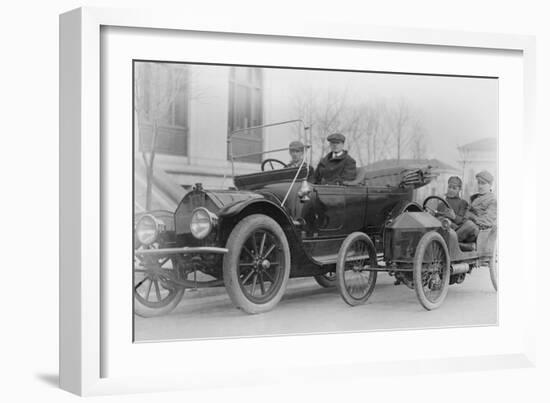 Two Men in a Large Auto are Side by Two Men in a Miniature Auto-null-Framed Art Print