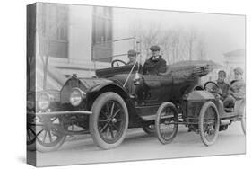 Two Men in a Large Auto are Side by Two Men in a Miniature Auto-null-Stretched Canvas