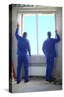 Two Men in Working Clothes Set New Window Frame into the Window Opening-Paha_L-Stretched Canvas