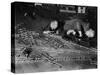 Two Men Lying on the Floor, Constructing a Railroad, at Toy Train Society-Alfred Eisenstaedt-Stretched Canvas