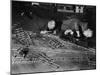 Two Men Lying on the Floor, Constructing a Railroad, at Toy Train Society-Alfred Eisenstaedt-Mounted Photographic Print