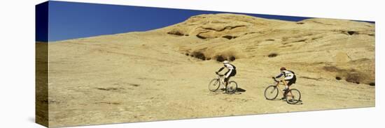 Two Men Mountain Bilking on Rocks, Slickrock Trail, Moab, Utah, USA-null-Stretched Canvas