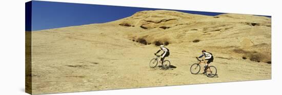 Two Men Mountain Bilking on Rocks, Slickrock Trail, Moab, Utah, USA-null-Stretched Canvas