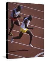 Two Men Racing on a Track-null-Stretched Canvas