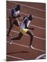 Two Men Racing on a Track-null-Mounted Photographic Print