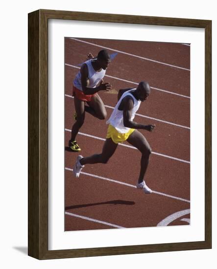 Two Men Racing on a Track-null-Framed Photographic Print