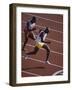 Two Men Racing on a Track-null-Framed Photographic Print