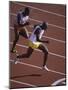 Two Men Racing on a Track-null-Mounted Photographic Print