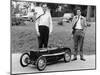 Two Men Standing by a Miniature Sunbeam Pedal Car, 1960S-null-Mounted Photographic Print