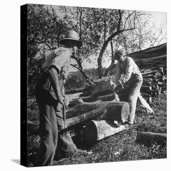 Two Men Using a Crosscut Saw on a Log-null-Stretched Canvas