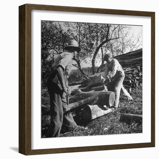 Two Men Using a Crosscut Saw on a Log-null-Framed Photographic Print