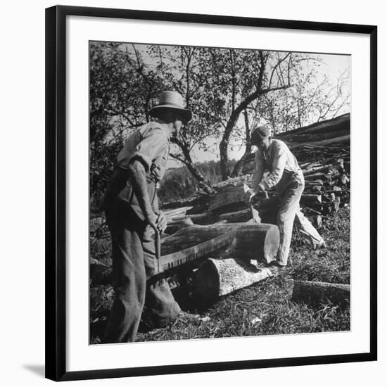 Two Men Using a Crosscut Saw on a Log-null-Framed Photographic Print