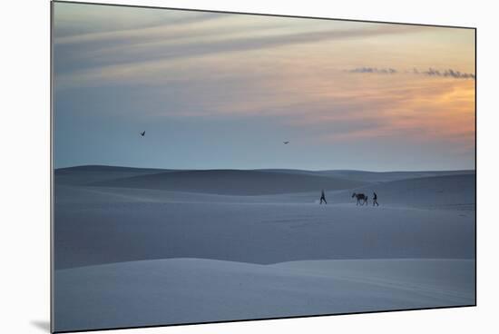 Two Men Walk a Donkey over Dunes at Sunset in Brazil's Lencois Maranhenses National Park-Alex Saberi-Mounted Photographic Print