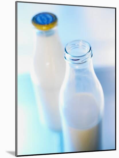 Two Milk Bottles, One Opened-Klaus Arras-Mounted Photographic Print