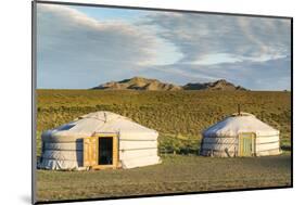 Two Mongolian nomadic gers and mountains in the background, Bayandalai district, South Gobi provinc-Francesco Vaninetti-Mounted Photographic Print