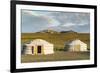 Two Mongolian nomadic gers and mountains in the background, Bayandalai district, South Gobi provinc-Francesco Vaninetti-Framed Photographic Print