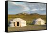 Two Mongolian nomadic gers and mountains in the background, Bayandalai district, South Gobi provinc-Francesco Vaninetti-Framed Stretched Canvas