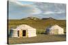 Two Mongolian nomadic gers and mountains in the background, Bayandalai district, South Gobi provinc-Francesco Vaninetti-Stretched Canvas