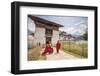Two Monks Dressed in Traditional Red Access the Punakha Dzong, Punakha-Roberto Moiola-Framed Photographic Print