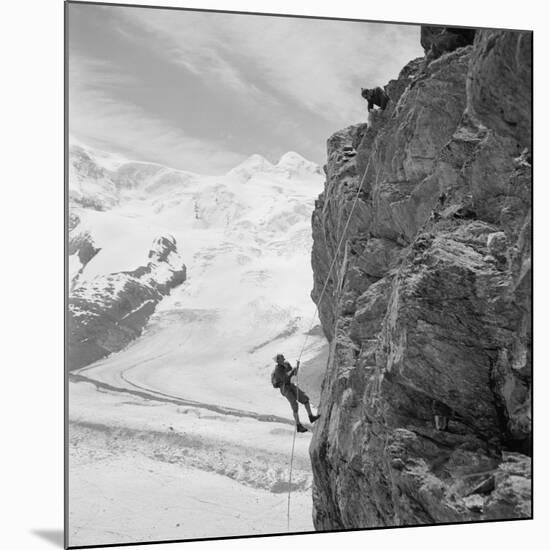 Two Mountain Climbers on the Side of a Mountain in Zermatt, Switzerland, 1954-null-Mounted Photo