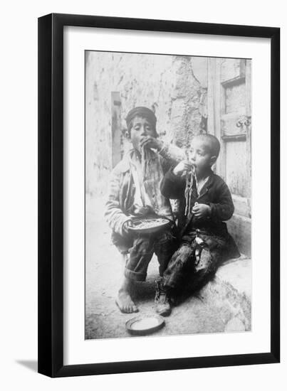 Two Neapolitan Children Slurp Down Spaghetti-null-Framed Art Print