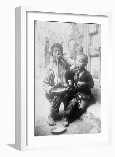 Two Neapolitan Children Slurp Down Spaghetti-null-Framed Art Print