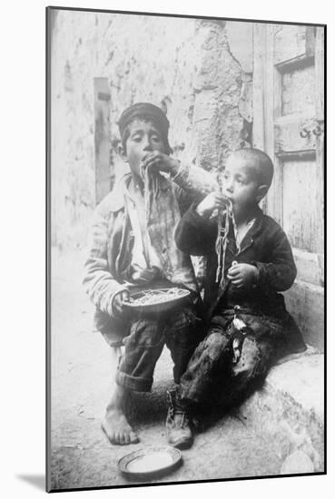 Two Neapolitan Children Slurp Down Spaghetti-null-Mounted Art Print