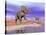 Two Nedoceratops Next to Water in a Colorful Rocky Landscape-null-Stretched Canvas