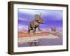 Two Nedoceratops Next to Water in a Colorful Rocky Landscape-null-Framed Art Print