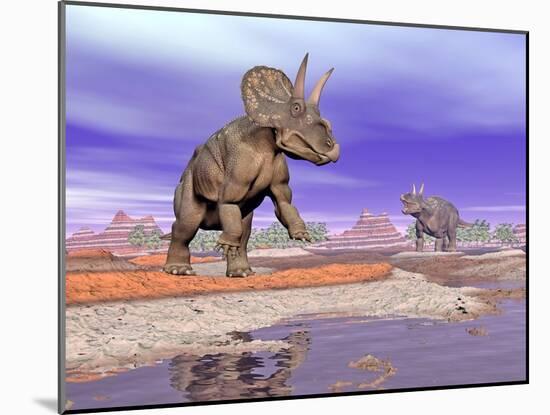 Two Nedoceratops Next to Water in a Colorful Rocky Landscape-null-Mounted Art Print
