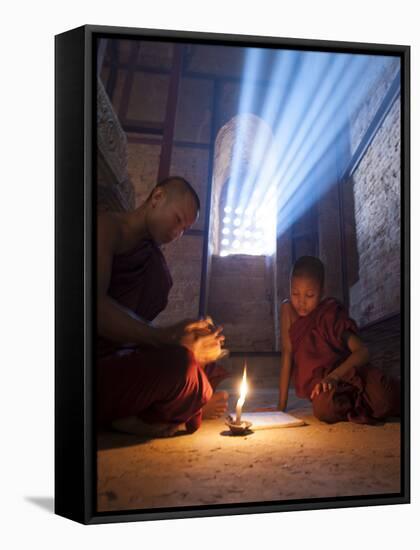 Two Novice Monks Reading Buddhist Texts Inside a Pagoda at Bagan in the Country of Burma (Myanmar)-Kyle Hammons-Framed Stretched Canvas