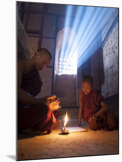 Two Novice Monks Reading Buddhist Texts Inside a Pagoda at Bagan in the Country of Burma (Myanmar)-Kyle Hammons-Mounted Photographic Print