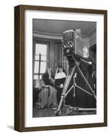 Two Nuns Smiling from the Wings While the Third Is Operating the Large TV Camera-null-Framed Photographic Print