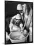 Two Nurses Bath a Baby-null-Mounted Art Print