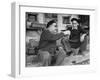 Two Older Basque Men Sitting on a Porch Toasting, as They Prepare to Drink Together-Dmitri Kessel-Framed Photographic Print