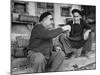 Two Older Basque Men Sitting on a Porch Toasting, as They Prepare to Drink Together-Dmitri Kessel-Mounted Photographic Print