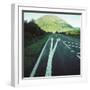 Two painted arrows on a road pointing towards a grassy mountain-null-Framed Photographic Print